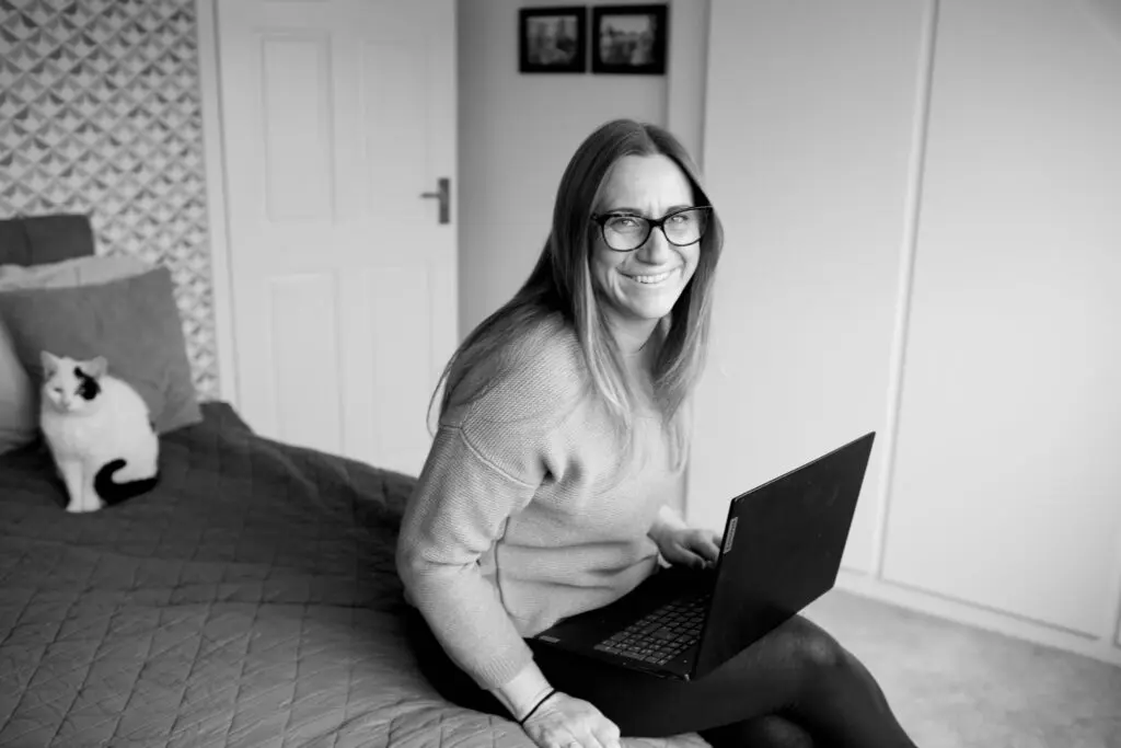 Woman working from home with her laptop while building a flexible business and lifestyle